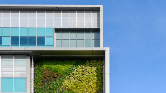 Modern green building with innovative high rise vertical garden