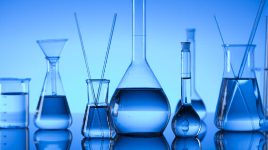 GettyImages-936335520_Science concept. Laboratory glassware. Chemical experiment. Blue background